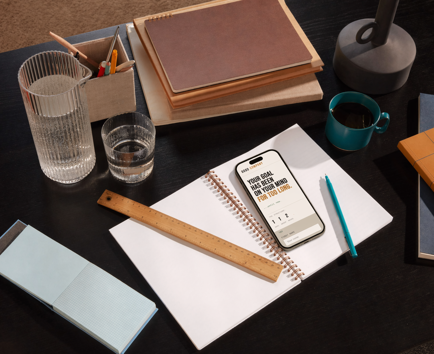 Workspace with laptop and notebook